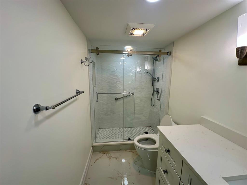 303 North Riverside Drive, Unit 1002 Pompano Beach, FL 33062 - Photo 20 of 27 a bathroom with a sink a toilet and shower