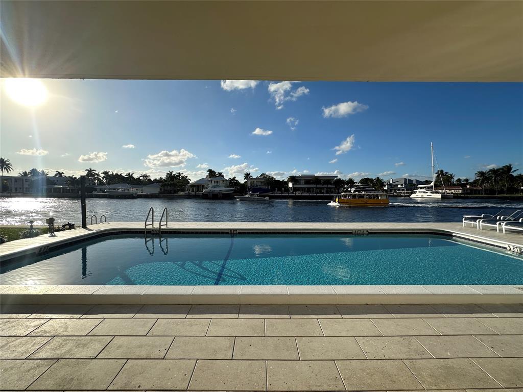 303 North Riverside Drive, Unit 1002 Pompano Beach, FL 33062 - Photo 23 of 27 a view of swimming pool and outdoor seating