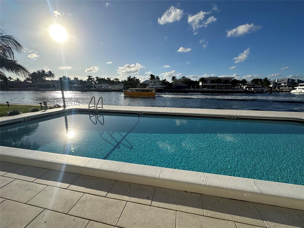 303 North Riverside Drive, Unit 1002 Pompano Beach, FL 33062 - Photo 24 of 27 a view of swimming pool from a outdoor space