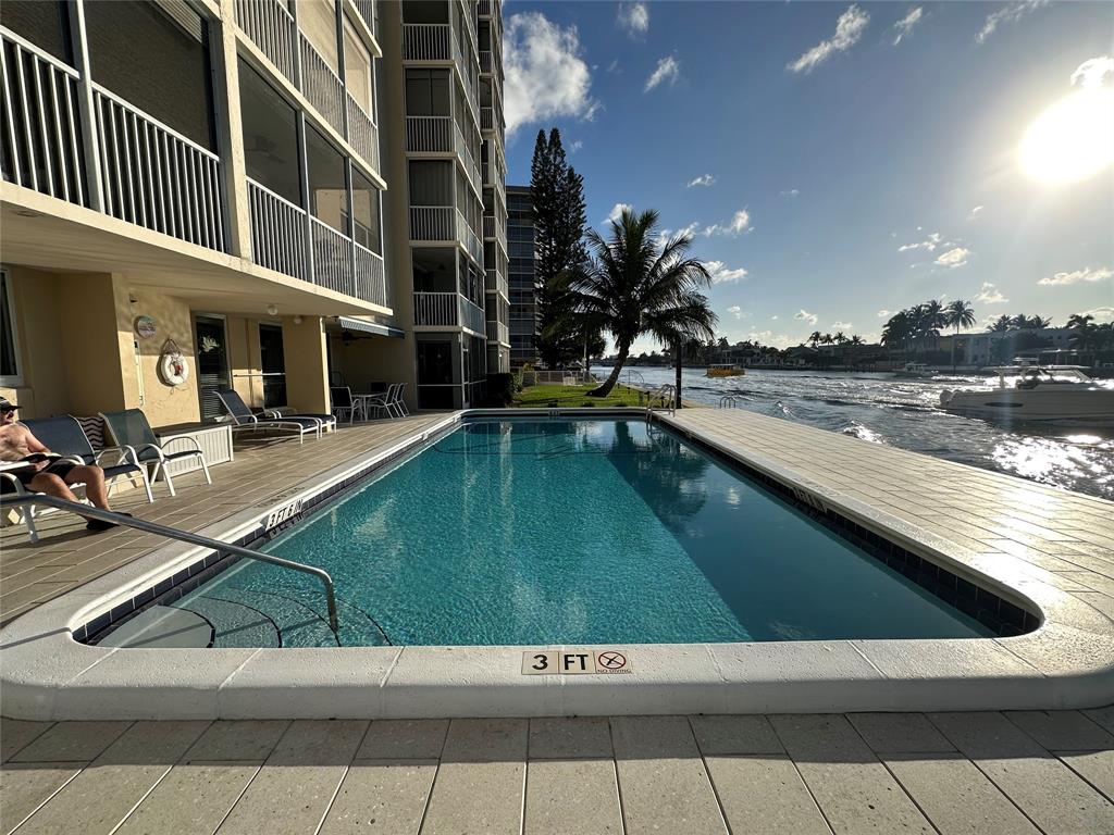 303 North Riverside Drive, Unit 1002 Pompano Beach, FL 33062 - Photo 25 of 27 a view of swimming pool with outdoor seating