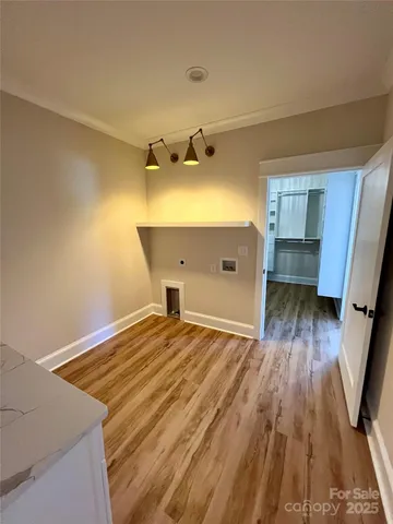 a view of kitchen and wooden floor