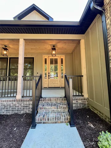 a front view of a house with wooden floor
