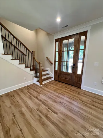 a view of entryway with wooden floor