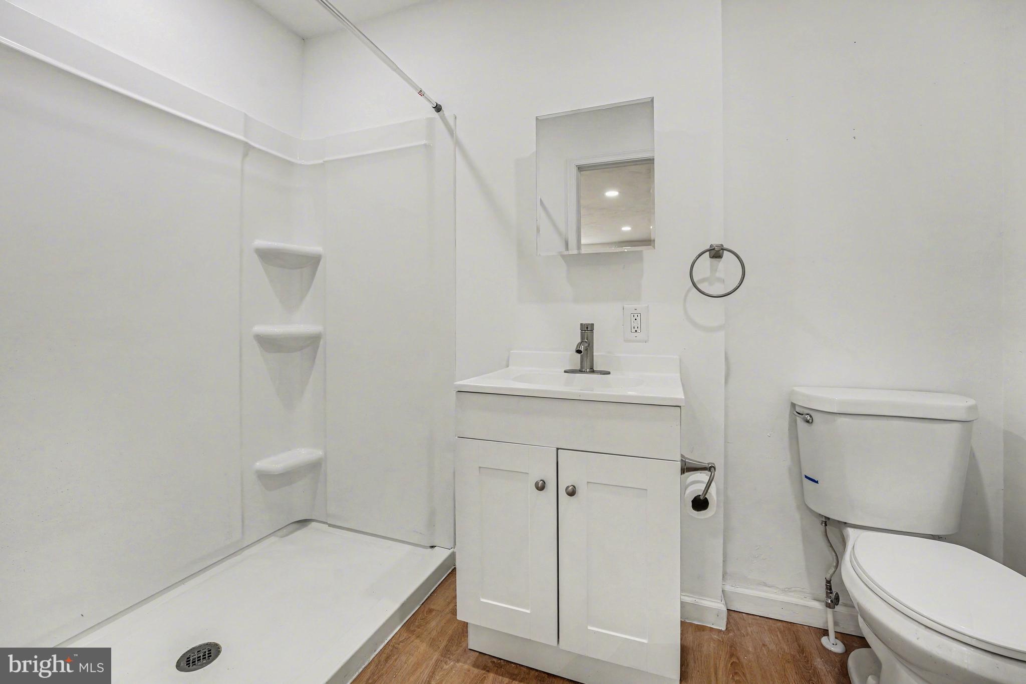 107 Allison Road Oreland, PA 19075 - Photo 11 of 54 a bathroom with a sink a toilet and a mirror