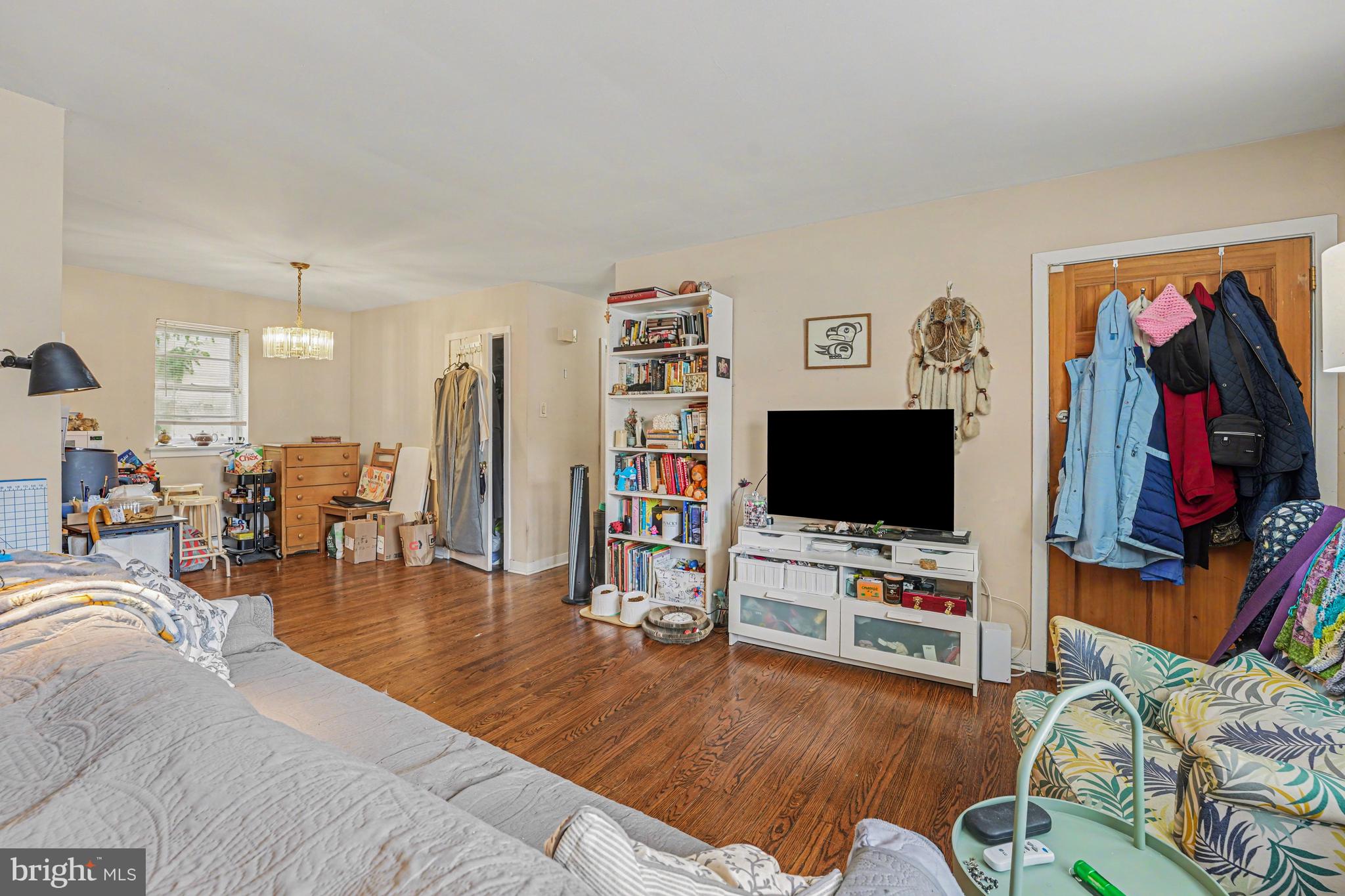 107 Allison Road Oreland, PA 19075 - Photo 22 of 54 a living room with furniture and a flat screen tv