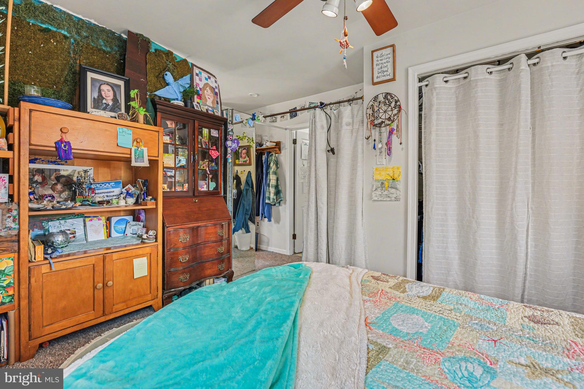 107 Allison Road Oreland, PA 19075 - Photo 41 of 54 a bed room with a bed and a book shelf