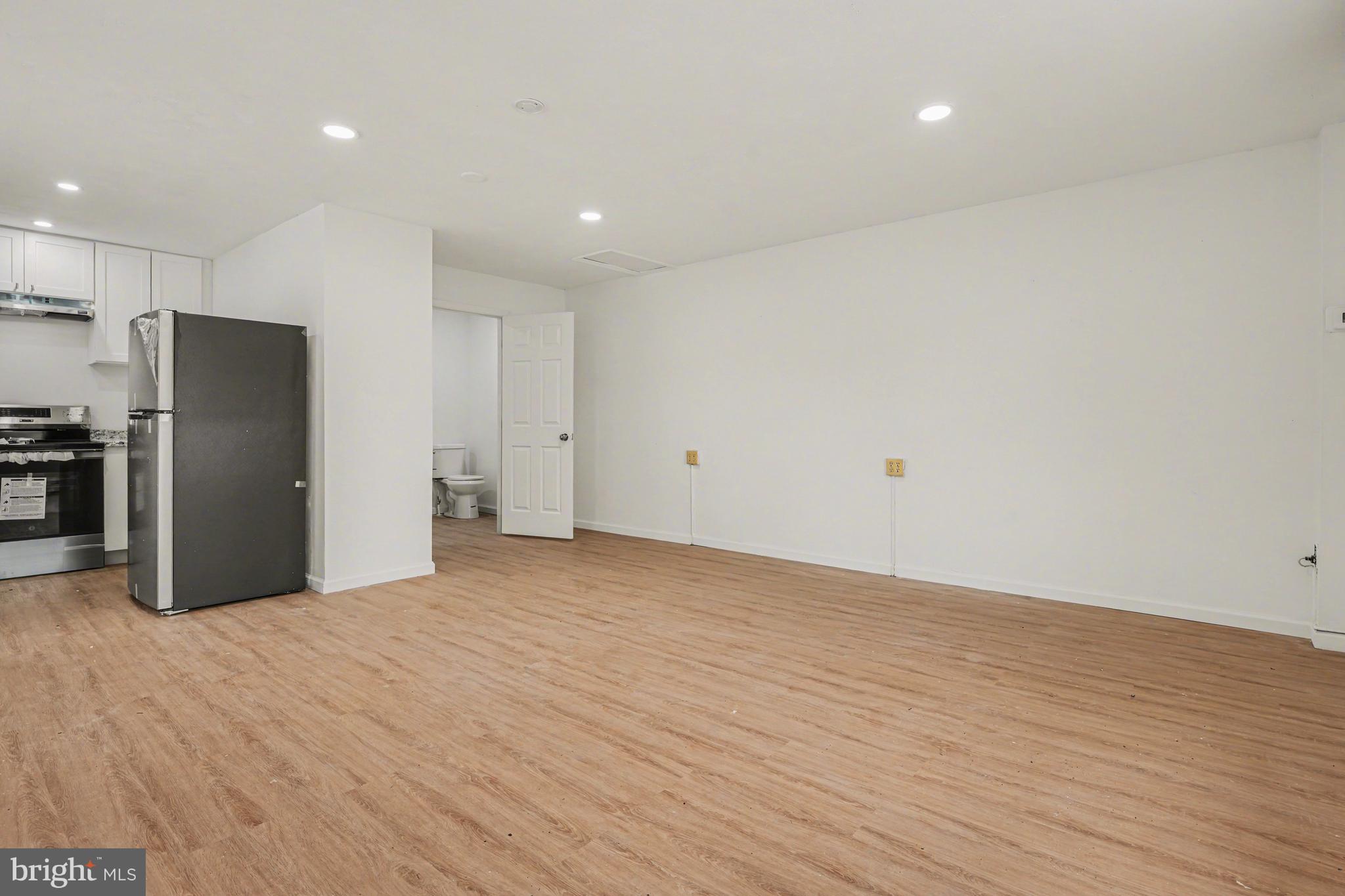 107 Allison Road Oreland, PA 19075 - Photo 5 of 54 a view of an empty room with wooden floor