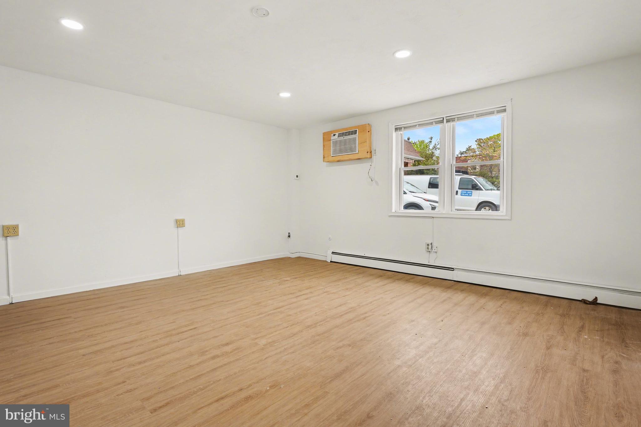 107 Allison Road Oreland, PA 19075 - Photo 7 of 54 wooden floor in an empty room with a window