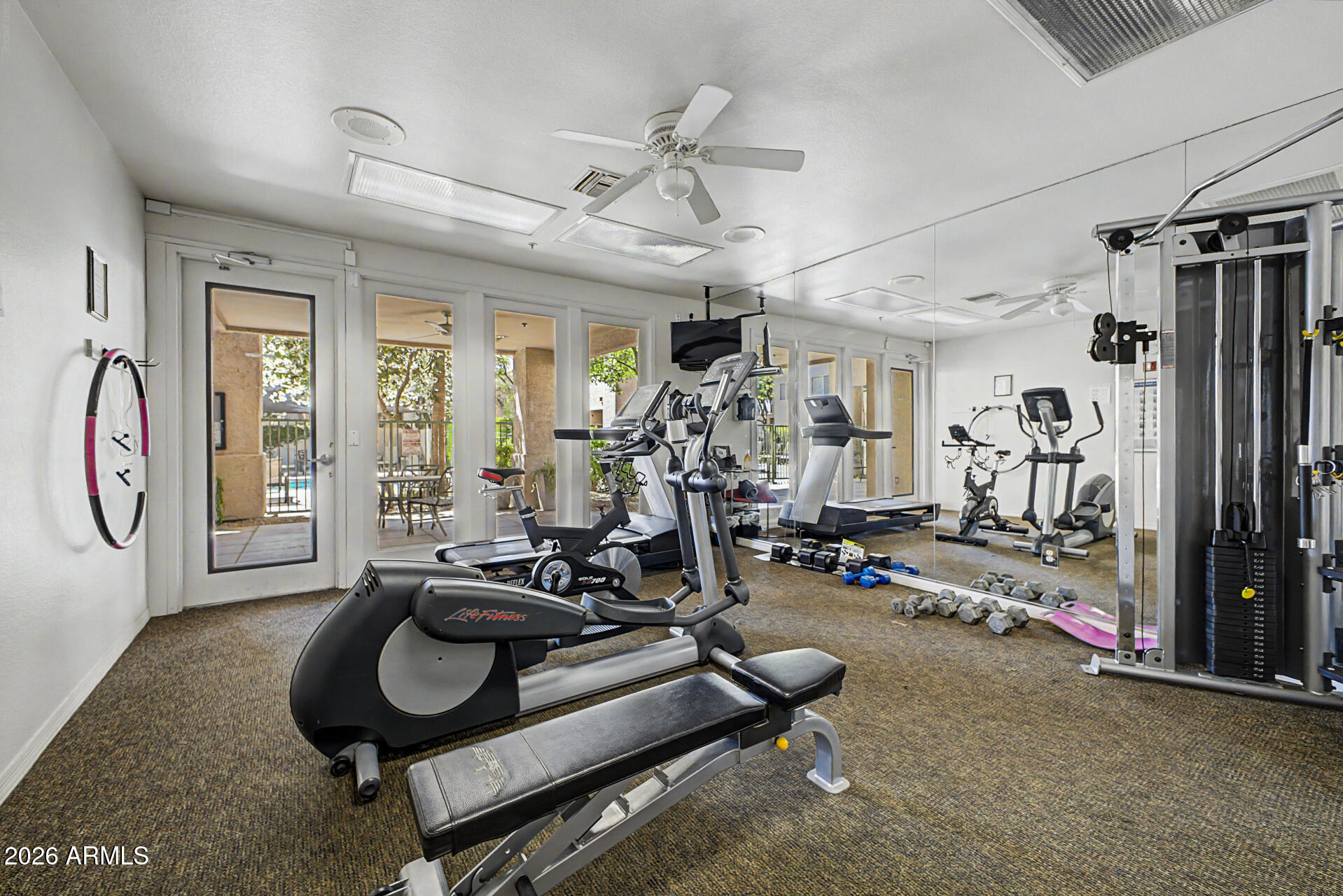 1295 North Ash Street, Unit 828 Gilbert, AZ 85233 - Photo 38 of 43 a room with gym equipment and a large window