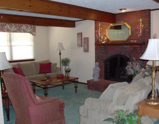 Den/Family/Great Room. Lovely, cozy, gas fireplace, leads to porch and has an area perfect for a large desk or bar!
