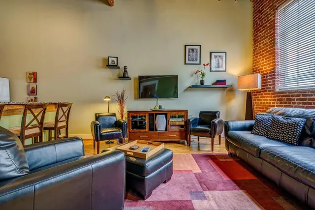 a view of a workspace with furniture