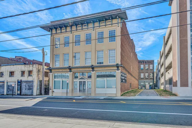 a view of a building on a street