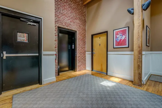 a view of backyard with a table and chairs and potted plants