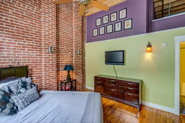 a bedroom with a bed and a dresser