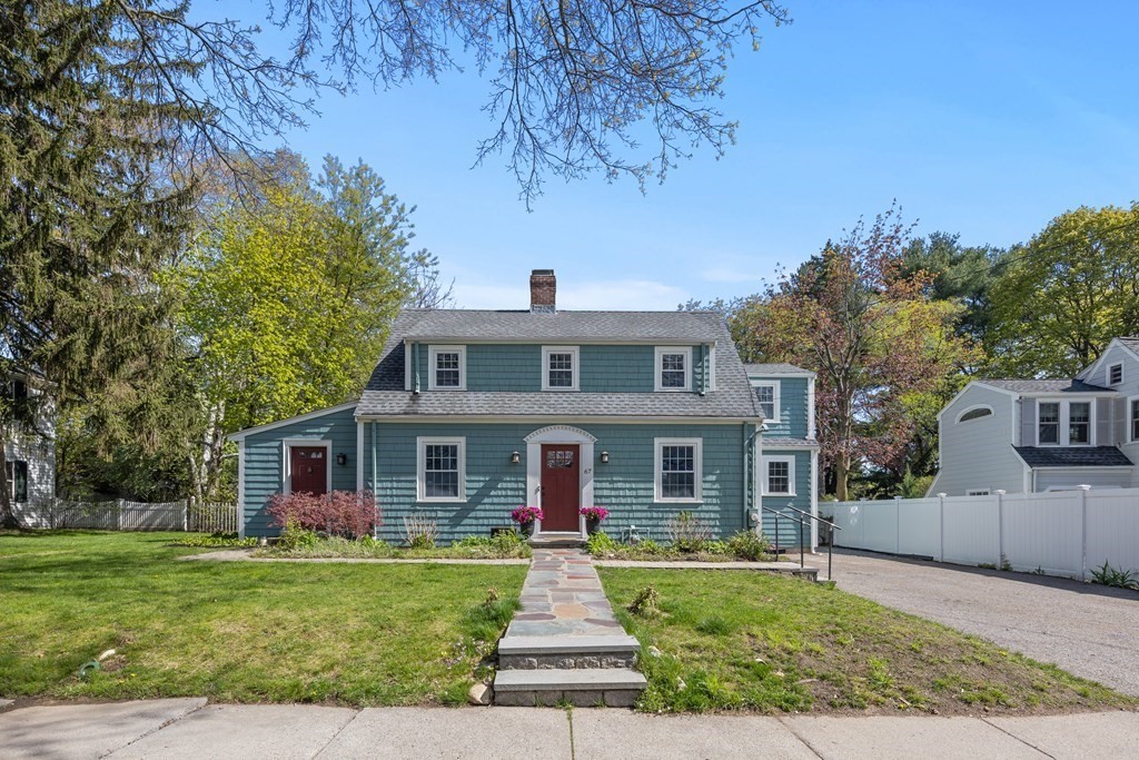 67 Randlett Park Newton, MA 02465 - Photo 1 of 41 a front view of a house with a yard