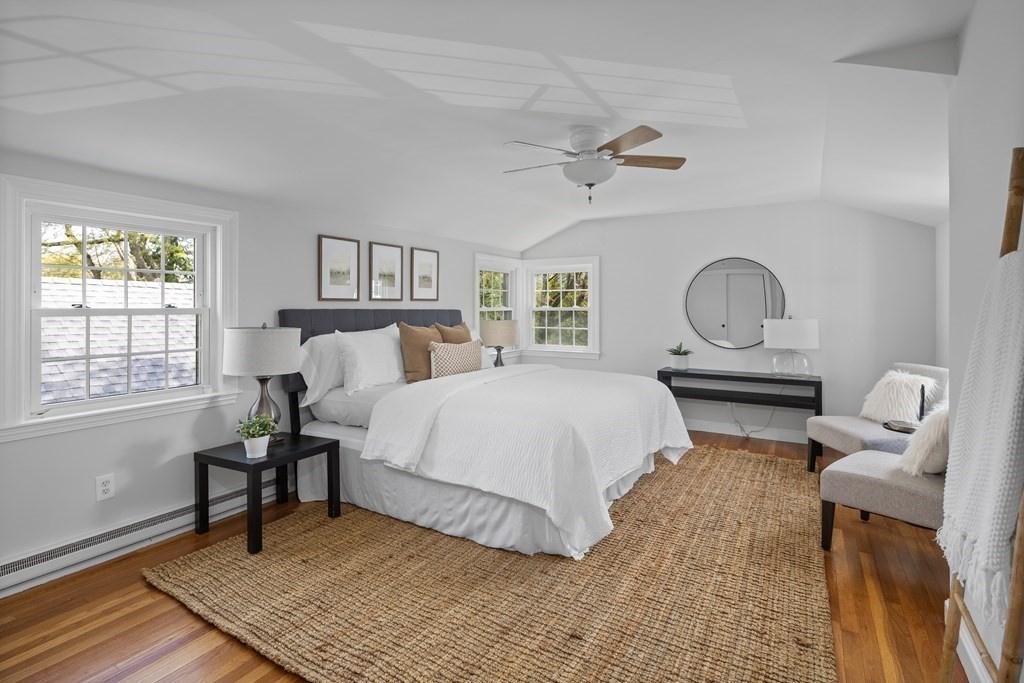 67 Randlett Park Newton, MA 02465 - Photo 20 of 41 a bedroom with a bed wooden floor and windows
