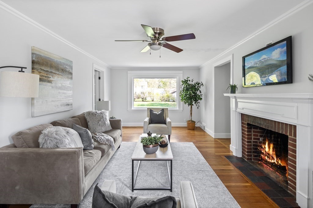 67 Randlett Park Newton, MA 02465 - Photo 2 of 41 a living room with furniture a window and a fireplace