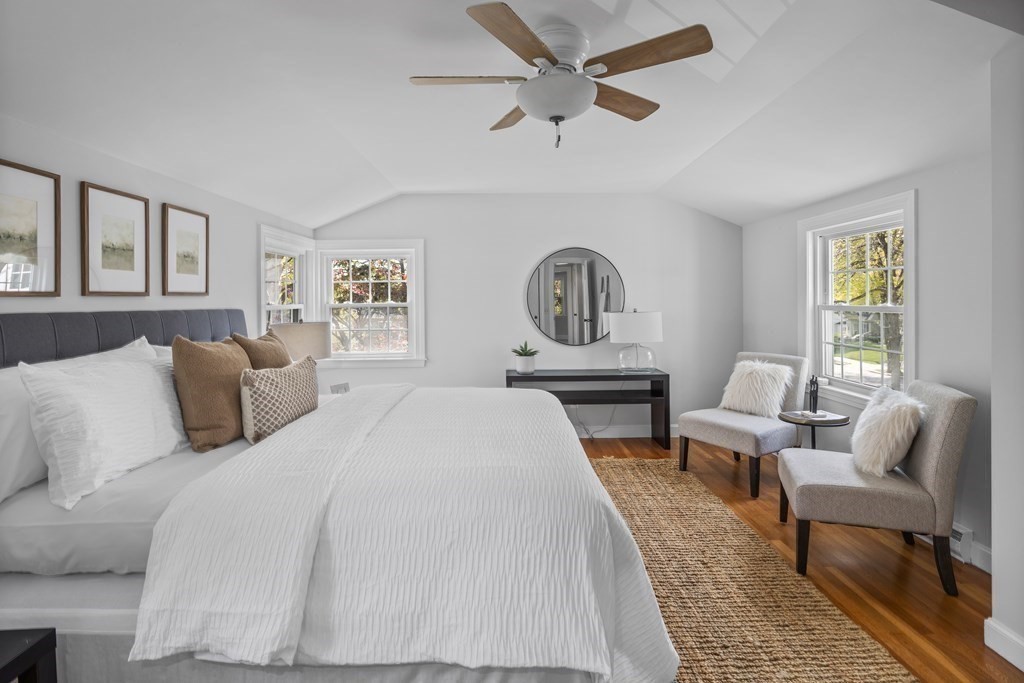 67 Randlett Park Newton, MA 02465 - Photo 22 of 41 a spacious bedroom with a bed a couch and a window