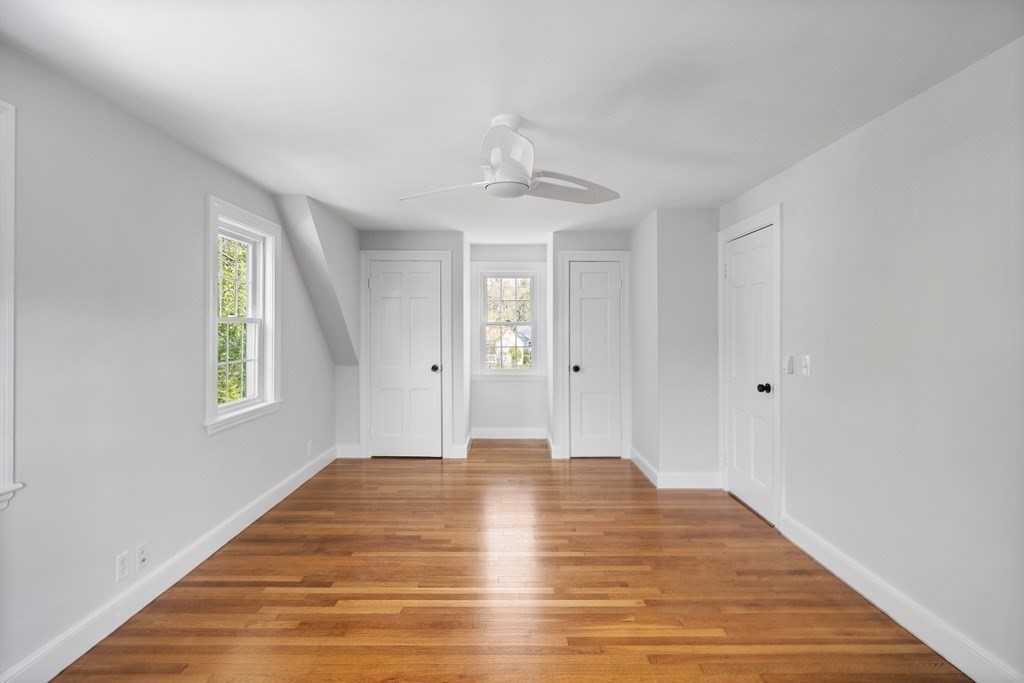 67 Randlett Park Newton, MA 02465 - Photo 24 of 41 a view of an empty room with wooden floor and a window