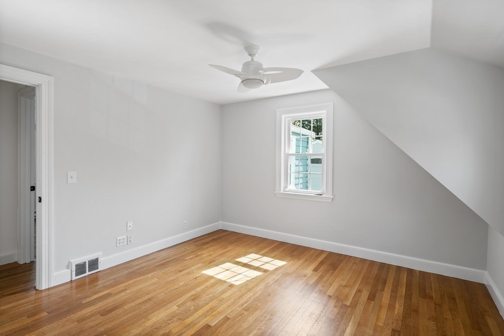 67 Randlett Park Newton, MA 02465 - Photo 26 of 41 wooden floor in an empty room with a window
