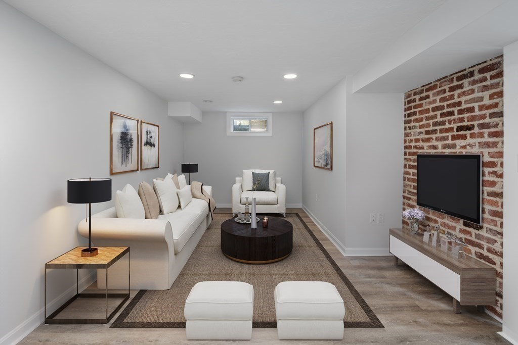 67 Randlett Park Newton, MA 02465 - Photo 30 of 41 a living room with furniture a flat screen tv and a fireplace