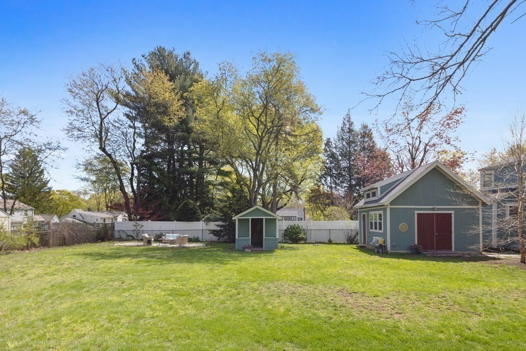 67 Randlett Park Newton, MA 02465 - Photo 38 of 41 a front view of a house with a garden and tree