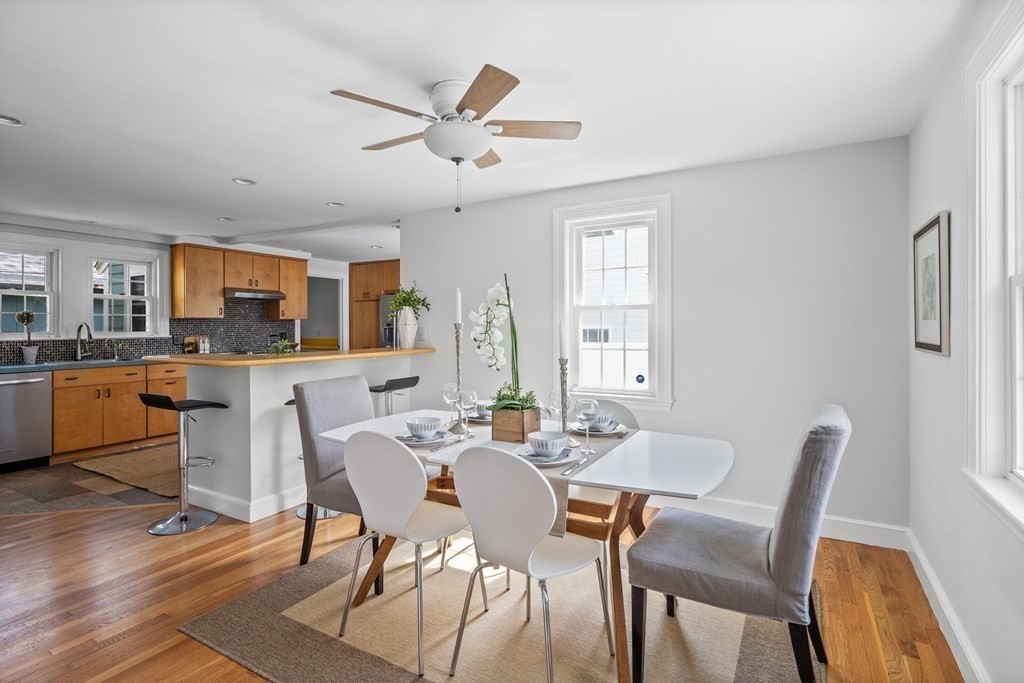 67 Randlett Park Newton, MA 02465 - Photo 8 of 41 a view of a dining room with furniture and wooden floor