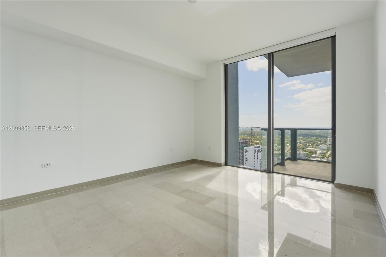 88 Southwest 7th Street, Unit 3710 Miami, FL 33130 - Photo 12 of 21 a view of an empty room with a window
