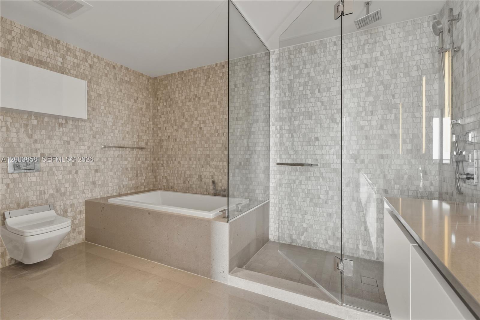 88 Southwest 7th Street, Unit 3710 Miami, FL 33130 - Photo 15 of 21 a bath room with a toilet and a bath tub