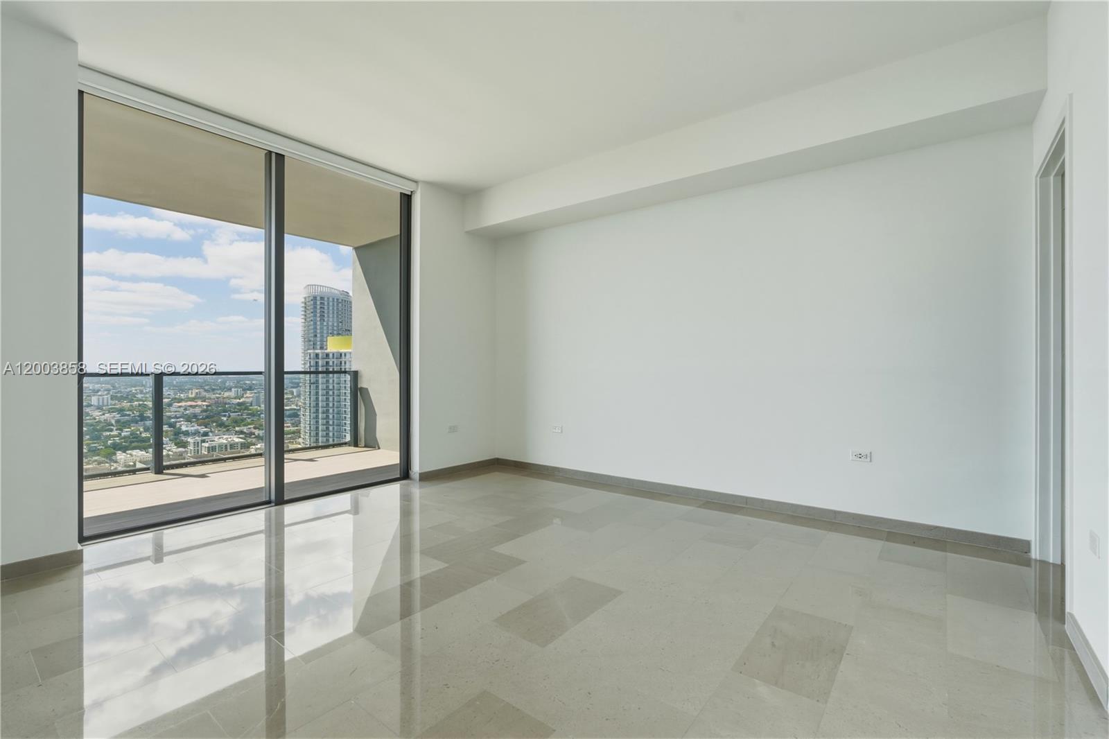 88 Southwest 7th Street, Unit 3710 Miami, FL 33130 - Photo 18 of 21 an empty room with glass door and glass door