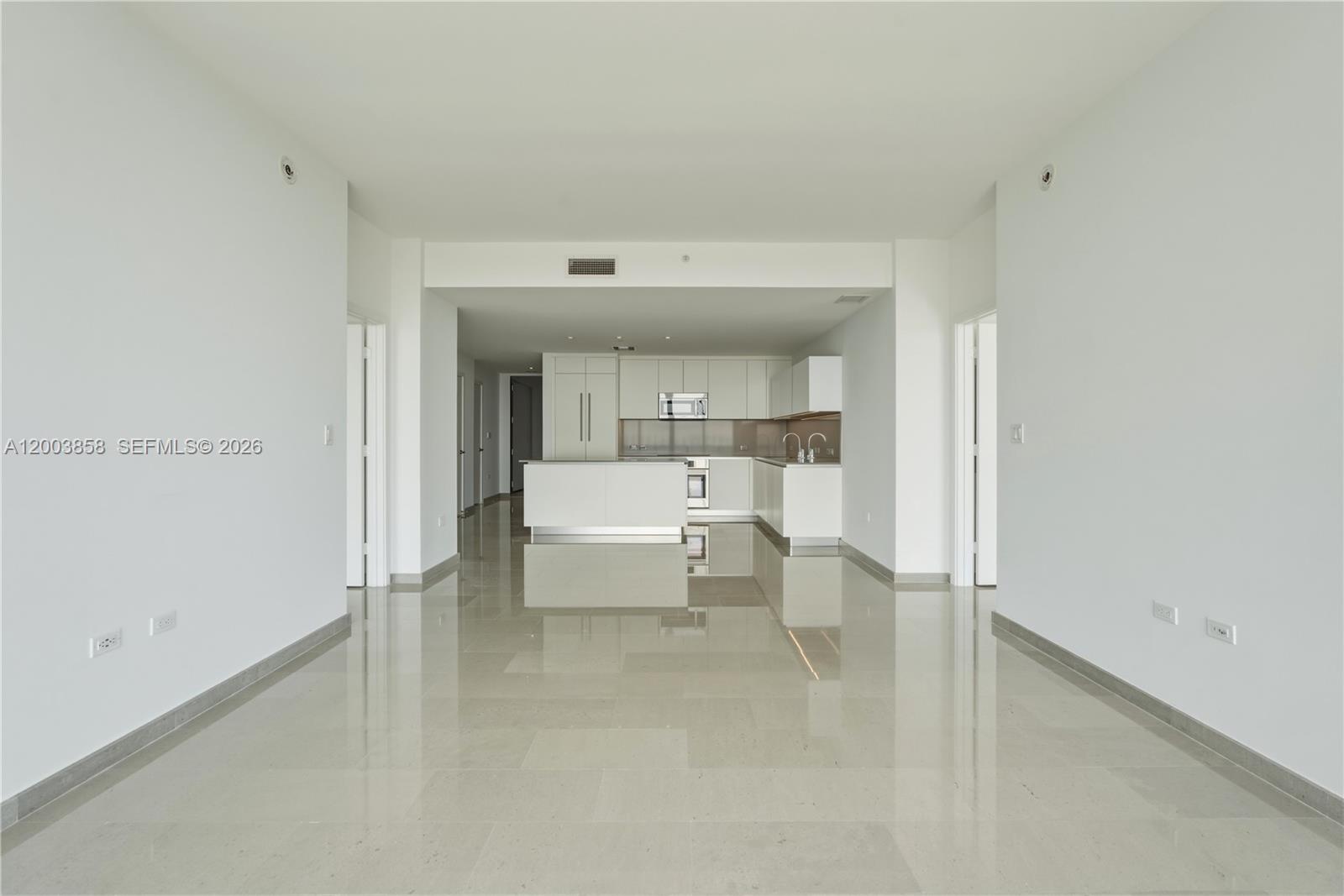 88 Southwest 7th Street, Unit 3710 Miami, FL 33130 - Photo 7 of 21 a living room with furniture and white walls