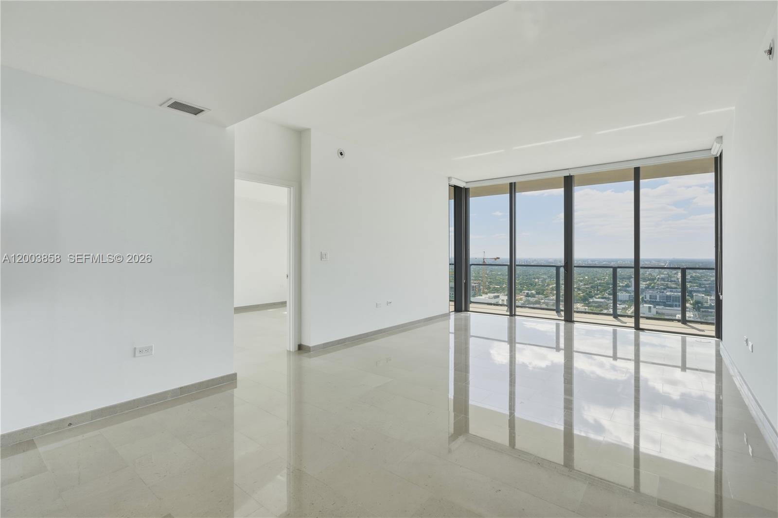 88 Southwest 7th Street, Unit 3710 Miami, FL 33130 - Photo 8 of 21 a view of empty room with sliding door