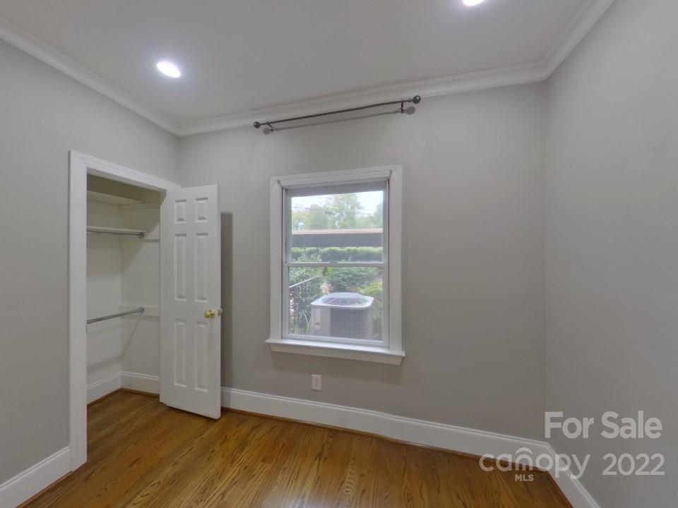 1012 Queens Road Charlotte, NC 28207 - Photo 12 of 13 a view of empty room with wooden floor and fan