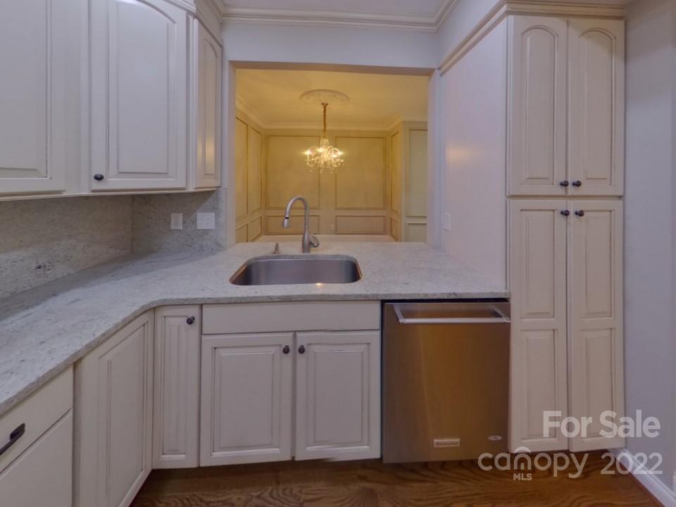 1012 Queens Road Charlotte, NC 28207 - Photo 4 of 13 a kitchen with a sink and cabinets
