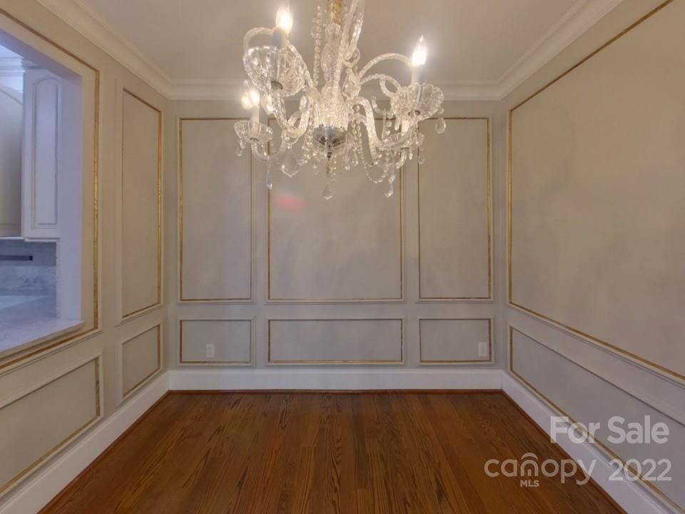 1012 Queens Road Charlotte, NC 28207 - Photo 6 of 13 wooden floor in an empty room with a window