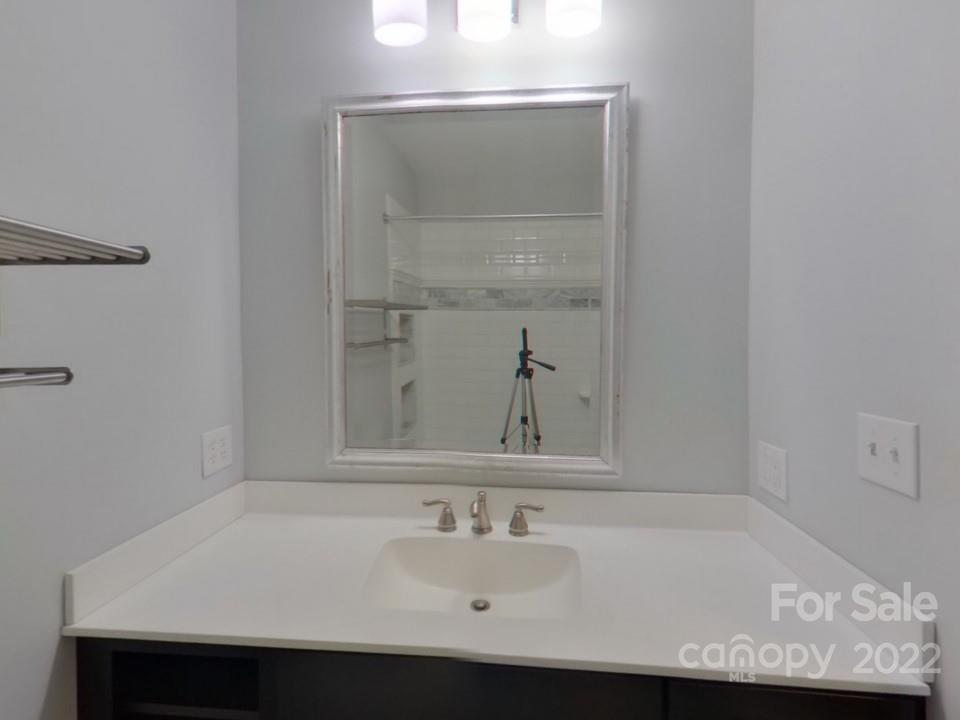 1012 Queens Road Charlotte, NC 28207 - Photo 9 of 13 a bathroom with a sink and a mirror