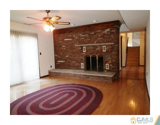 200 Old Forge Road Monroe Township, NJ 08831 - Photo 12 of 25 a view of living room with granite countertop furniture and fireplace