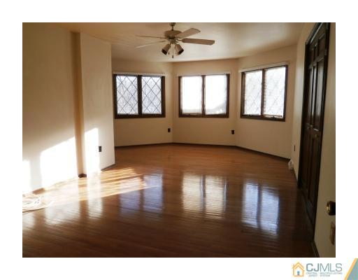 200 Old Forge Road Monroe Township, NJ 08831 - Photo 14 of 25 a view interior of a house wooden floor and a chandelier
