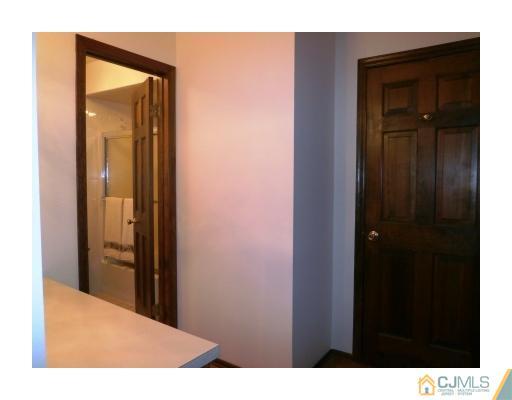 200 Old Forge Road Monroe Township, NJ 08831 - Photo 17 of 25 a view of a bathroom from a hallway