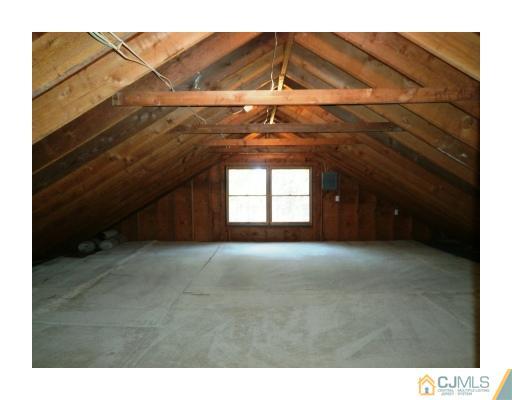200 Old Forge Road Monroe Township, NJ 08831 - Photo 18 of 25 a view of an empty room with a ceiling fan and window