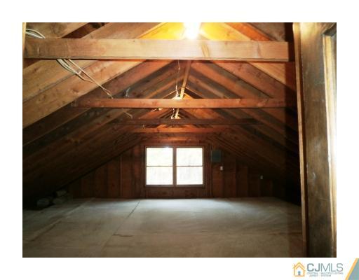 200 Old Forge Road Monroe Township, NJ 08831 - Photo 19 of 25 a view of an empty room with a window and wooden floor
