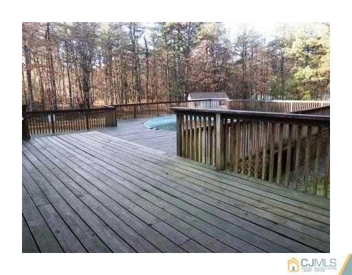 200 Old Forge Road Monroe Township, NJ 08831 - Photo 21 of 25 a view of balcony with wooden floor and fence
