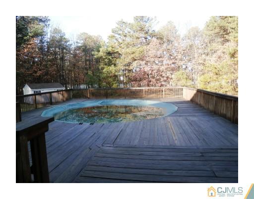 200 Old Forge Road Monroe Township, NJ 08831 - Photo 22 of 25 a view of roof deck with patio