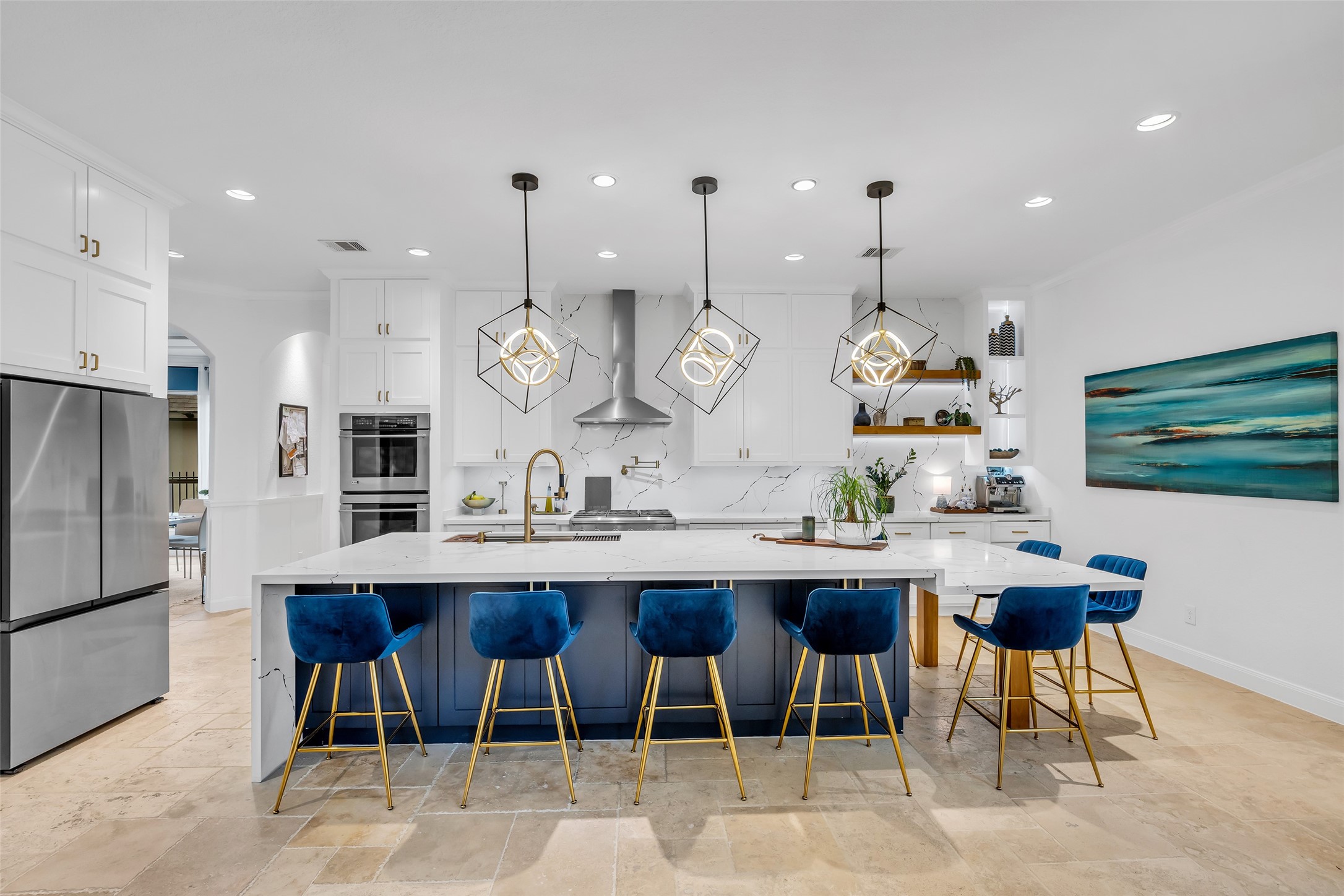 143 West Valera Ridge Place Spring, TX 77389 - Photo 14 of 50 a kitchen with stainless steel appliances kitchen island a table and chairs in it