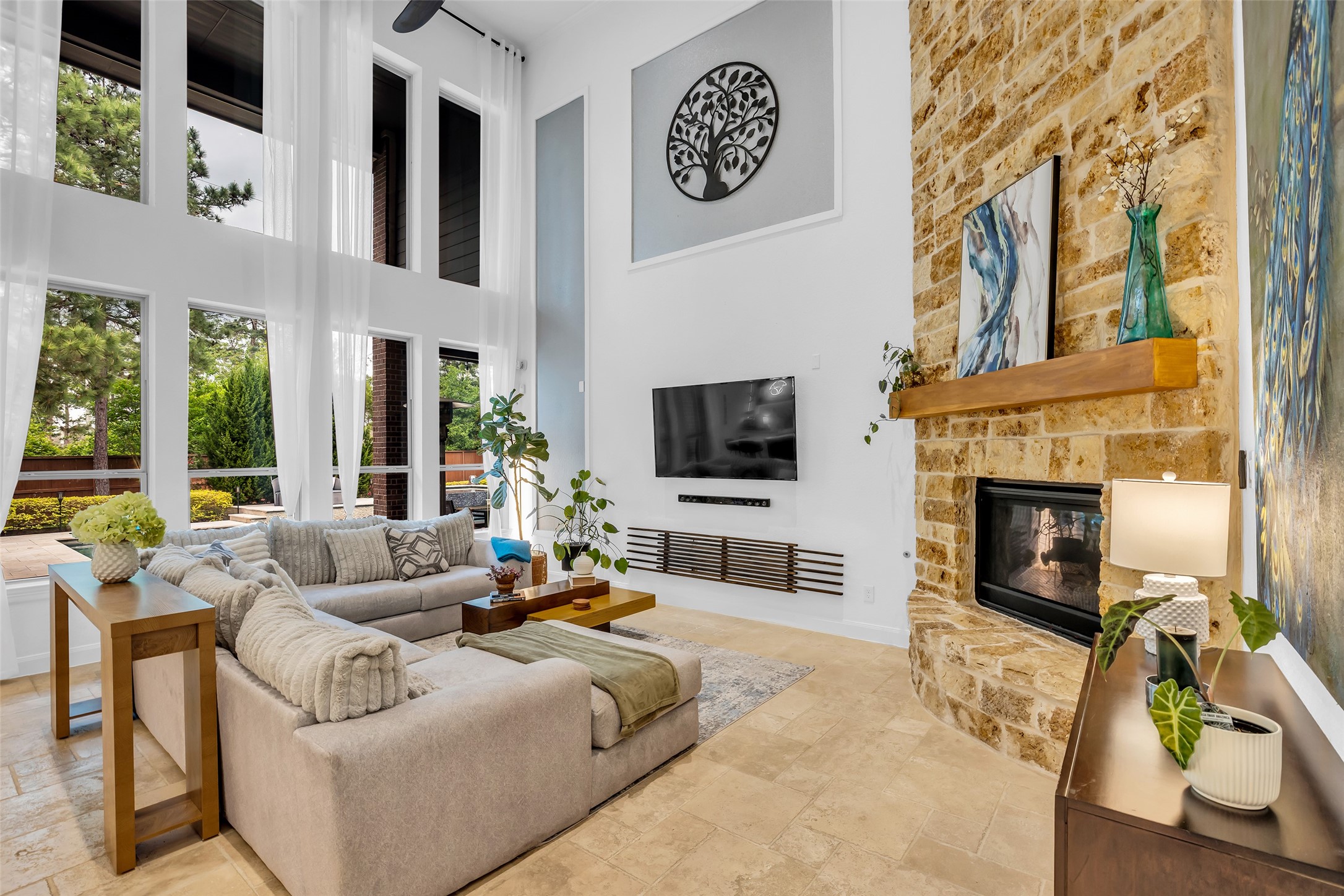 143 West Valera Ridge Place Spring, TX 77389 - Photo 19 of 50 a living room with furniture a fireplace and a flat screen tv