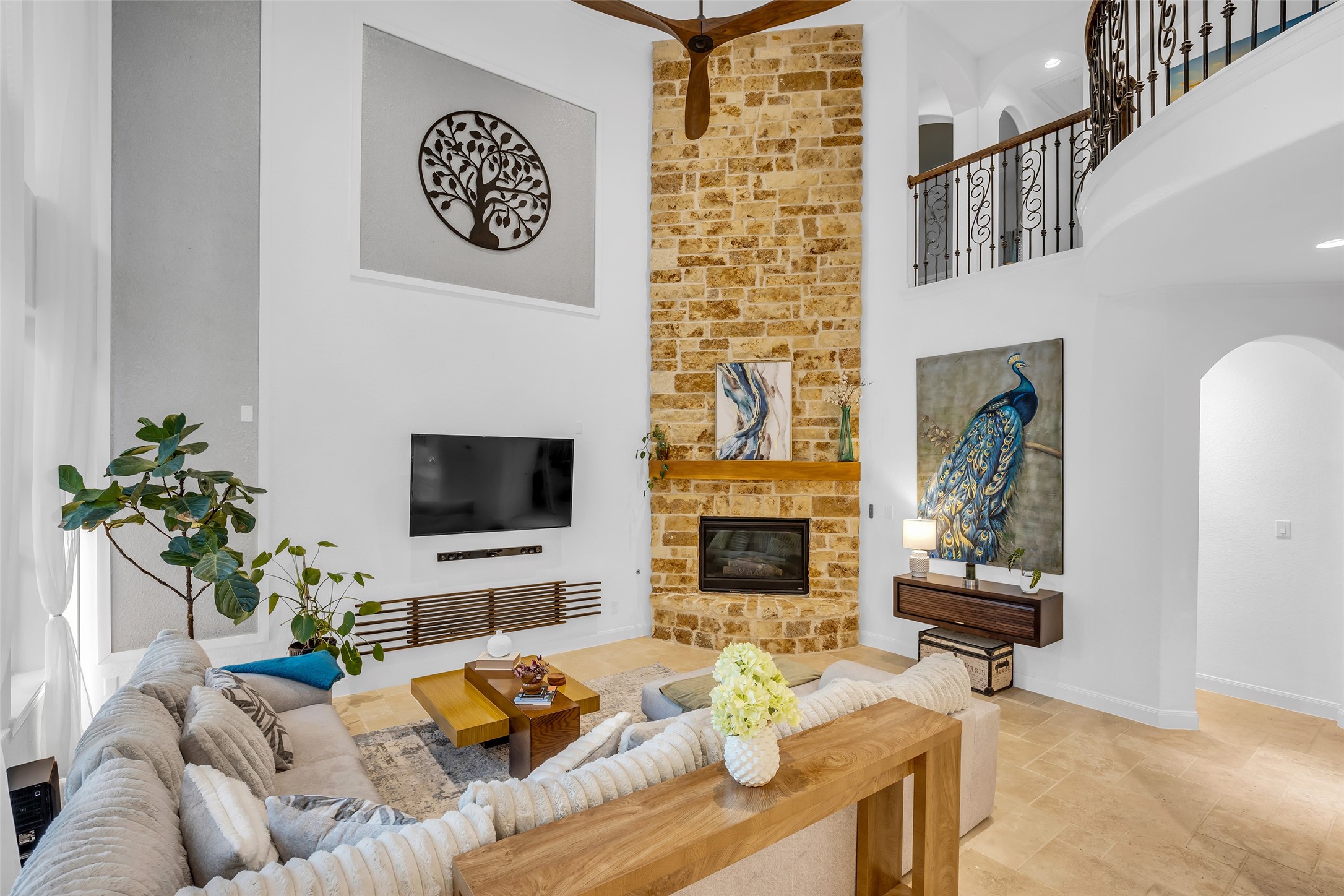 143 West Valera Ridge Place Spring, TX 77389 - Photo 20 of 50 a living room with furniture a fireplace and a flat screen tv