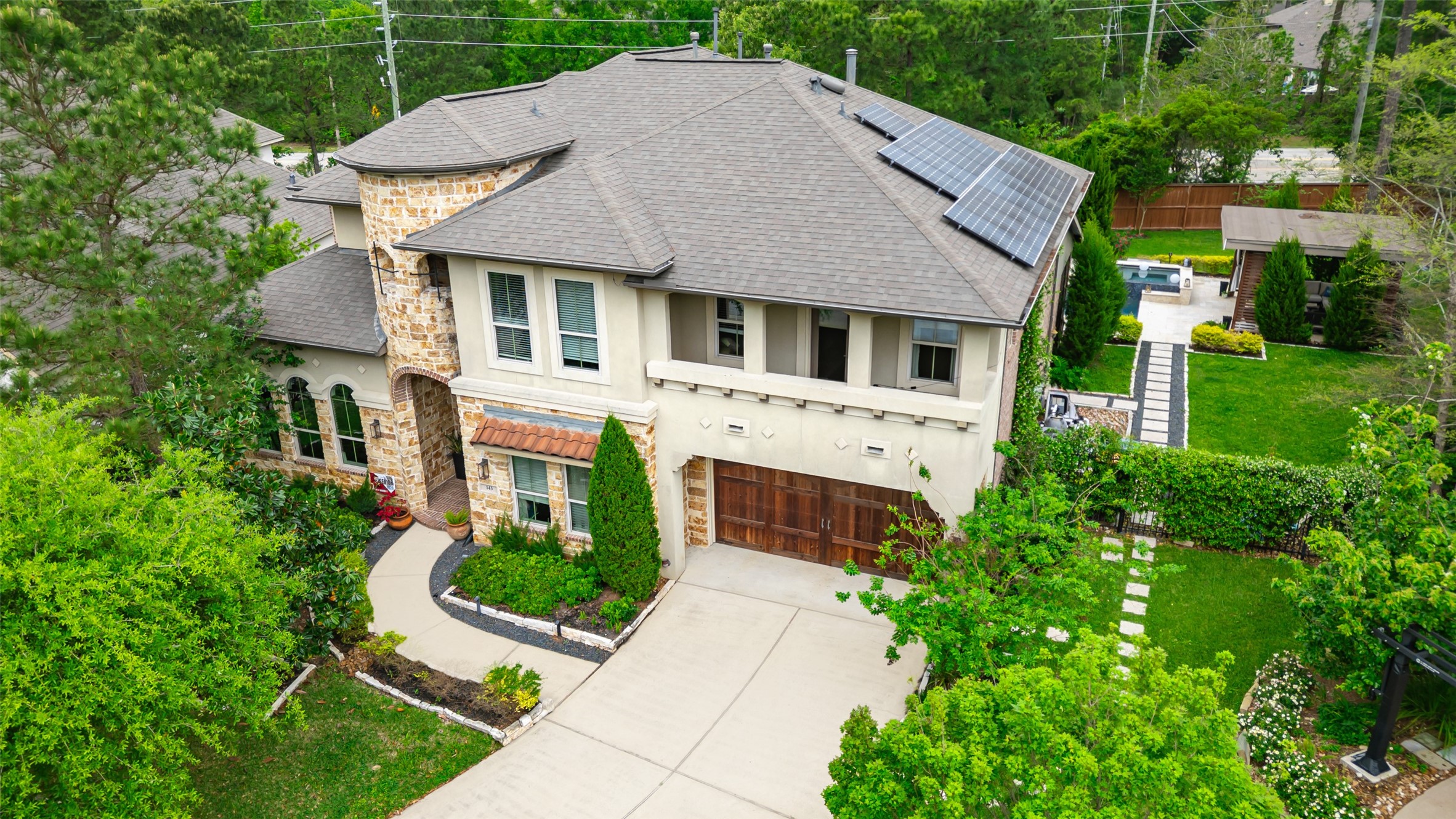 143 West Valera Ridge Place Spring, TX 77389 - Photo 2 of 50 a aerial view of a house with a yard and potted plants