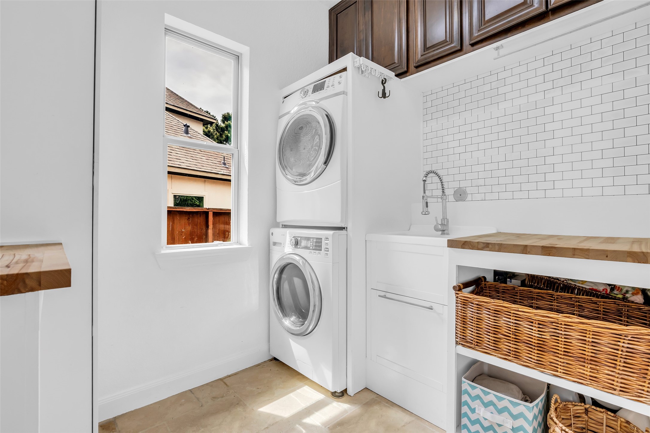 143 West Valera Ridge Place Spring, TX 77389 - Photo 22 of 50 a view of storage and utility room with washer and dryer