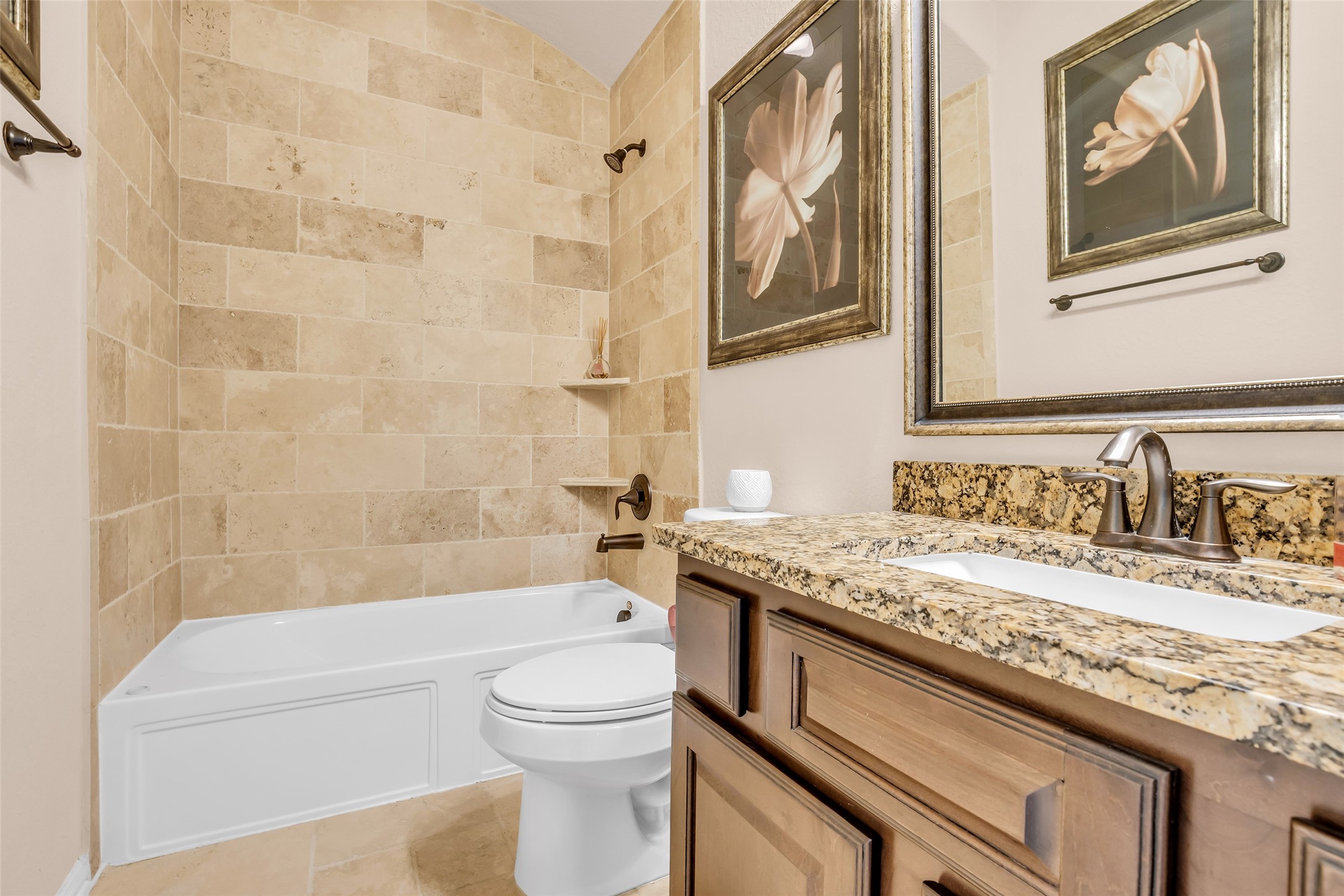 143 West Valera Ridge Place Spring, TX 77389 - Photo 29 of 50 a bathroom with a granite countertop bathtub sink vanity mirror and toilet