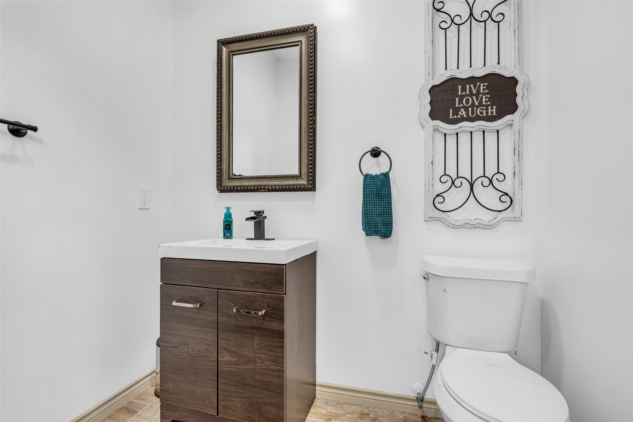 143 West Valera Ridge Place Spring, TX 77389 - Photo 43 of 50 a bathroom with a toilet a sink and mirror